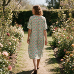 Ginny spring dress back view on a garden path