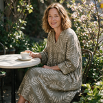 Lucy spring dress three quarter view at an outdoor cafe
