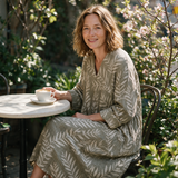 Lucy spring dress three quarter view at an outdoor cafe