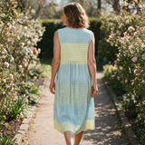 Lisa spring dress back view on a garden path
