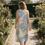Miranda spring dress back view on a garden path
