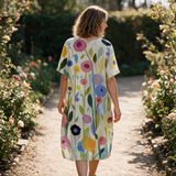 Lydia spring dress back view on a garden path