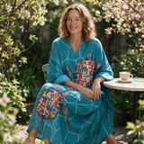 Milly spring dress three quarter view at an outdoor cafe