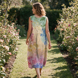Brooke spring dress back view on a garden path