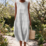 Faye spring dress in a sunlit garden