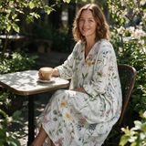 Belinda spring dress three quarter view at an outdoor cafe