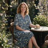 Marika spring dress three quarter view at an outdoor cafe