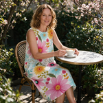 Felicity spring dress three quarter view at an outdoor cafe