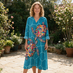 Milly spring dress front view on garden terrace