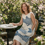 Sally spring dress three quarter view at an outdoor cafe