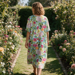 Bronwyn spring dress back view on a garden path