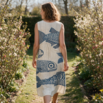 Sally spring dress back view on a garden path