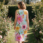 Felicity spring dress back view on a garden path