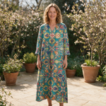 Nicole spring dress front view on garden terrace