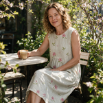 Zoe spring dress three quarter view at an outdoor cafe