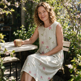 Zoe spring dress three quarter view at an outdoor cafe