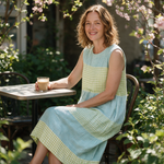 Lisa spring dress three quarter view at an outdoor cafe