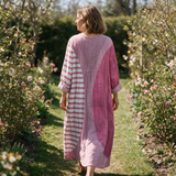 Narelle spring dress back view on a garden path