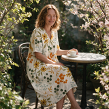 Josephine spring dress three quarter view at an outdoor cafe
