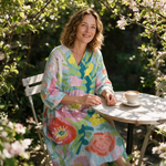 Linaëlle spring dress three quarter view at an outdoor cafe