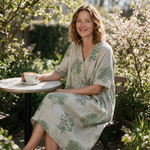 Luise spring dress three quarter view at an outdoor cafe