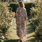 Gillian spring dress back view on a garden path