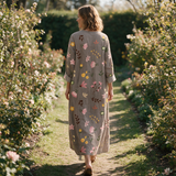Gillian spring dress back view on a garden path