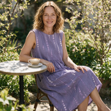 Roxanne spring dress three quarter view at an outdoor cafe