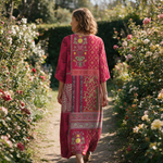 Willow spring dress back view on a garden path