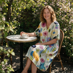 Lydia spring dress three quarter view at an outdoor cafe
