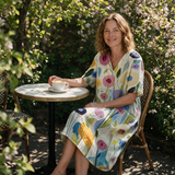 Lydia spring dress three quarter view at an outdoor cafe