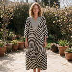 Sienna spring dress front view on garden terrace
