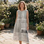 Janelle spring dress front view on garden terrace
