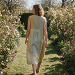 Bridie spring dress back view on a garden path