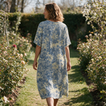 Lisou spring dress back view on a garden path