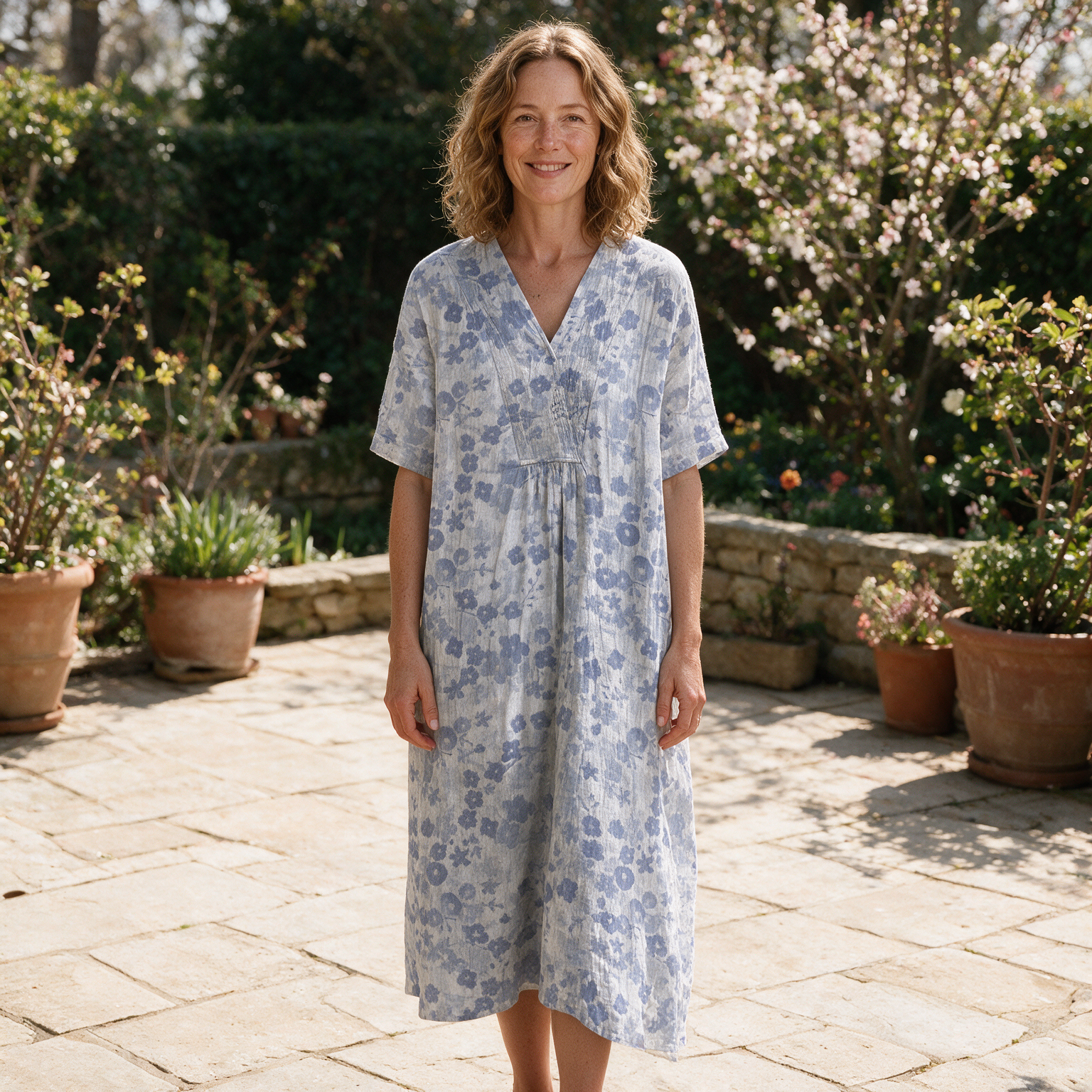 Nadine spring dress front view on garden terrace