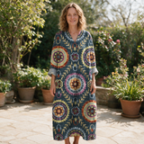 Cameline spring dress front view on garden terrace