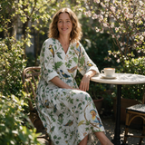 Elise spring dress three quarter view at an outdoor cafe