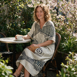 Margie spring dress three quarter view at an outdoor cafe