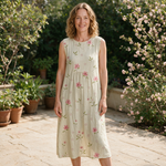 Zoe spring dress front view on garden terrace