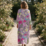 Pippa spring dress back view on a garden path