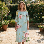 Shelley spring dress front view on garden terrace