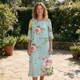 Shelley spring dress front view on garden terrace