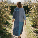 Bronte spring dress back view on a garden path