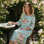 Shelley spring dress three quarter view at an outdoor cafe