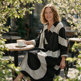 Melinda spring dress three quarter view at an outdoor cafe