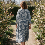 Lilouette spring dress back view on a garden path