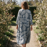 Lilouette spring dress back view on a garden path