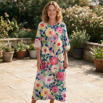 Fleur spring dress front view on garden terrace
